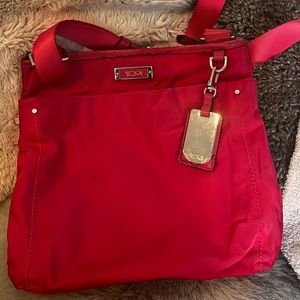 TUMI Voyageur magenta crossbody bag ,  gently worn, good condition